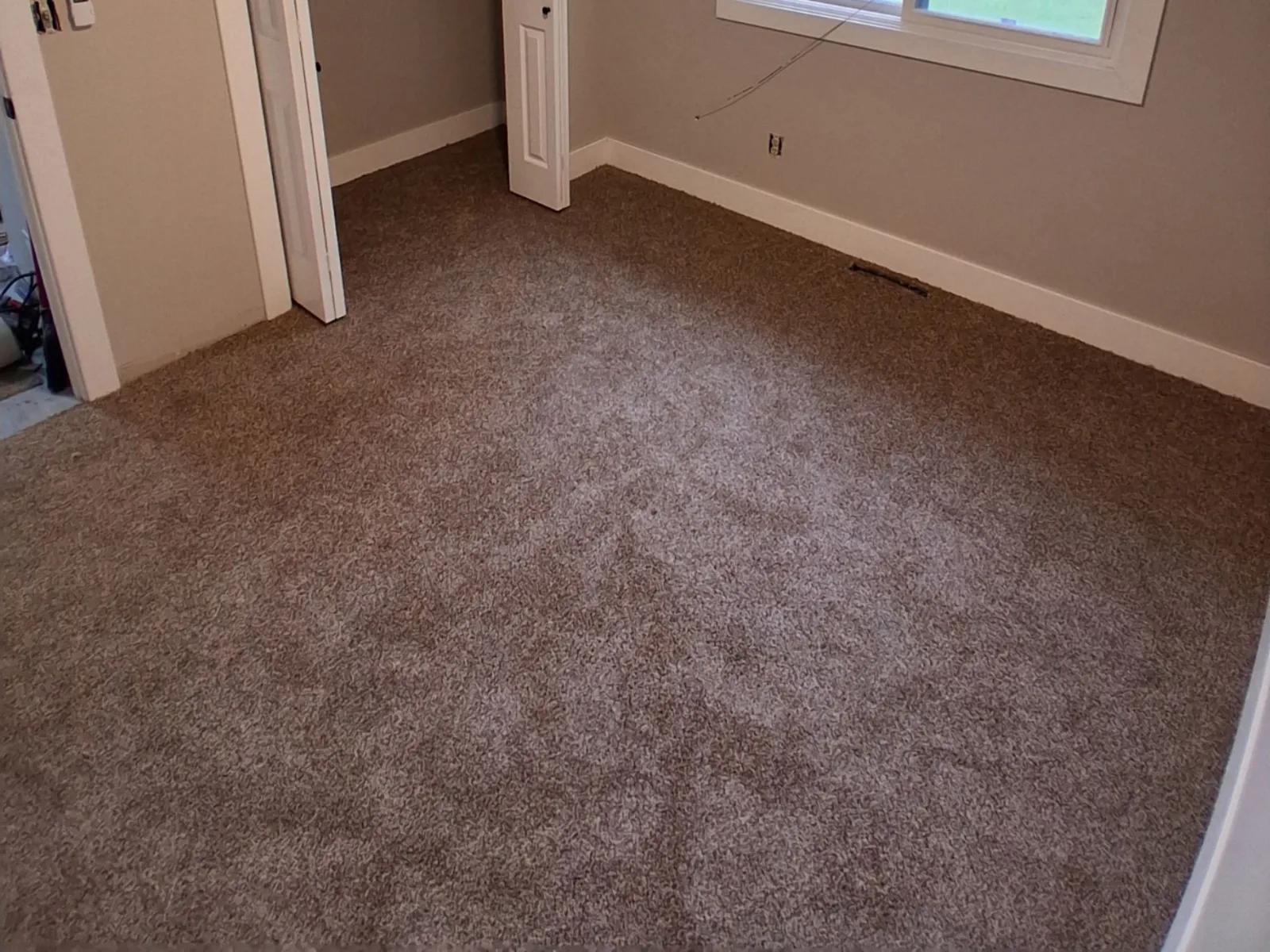 New bedroom carpet laid wall to wall and carried through into the closet