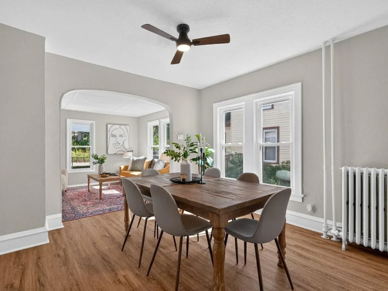 Dining room with windows on two sides and a radiator
