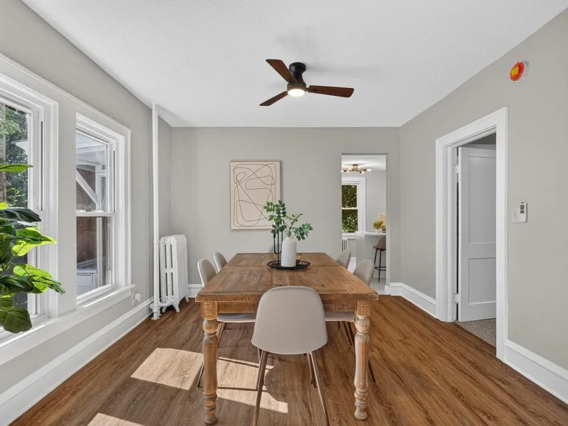Dining room with a long table and hard-surface flooring