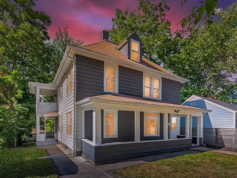 The front of the duplex photographed at dusk