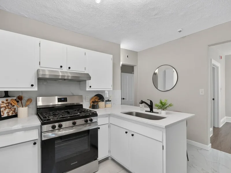 Kitchen with a gas range, peninsula and undermount sink