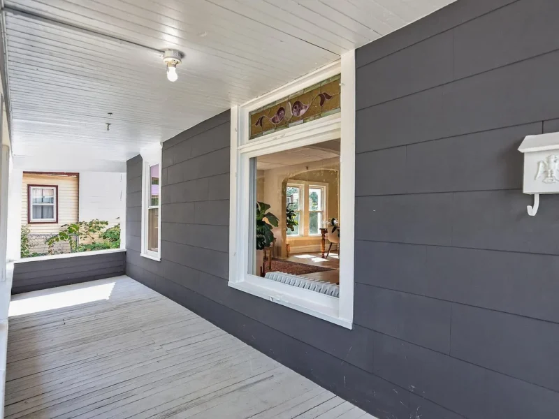 Covered front porch running the width of the house