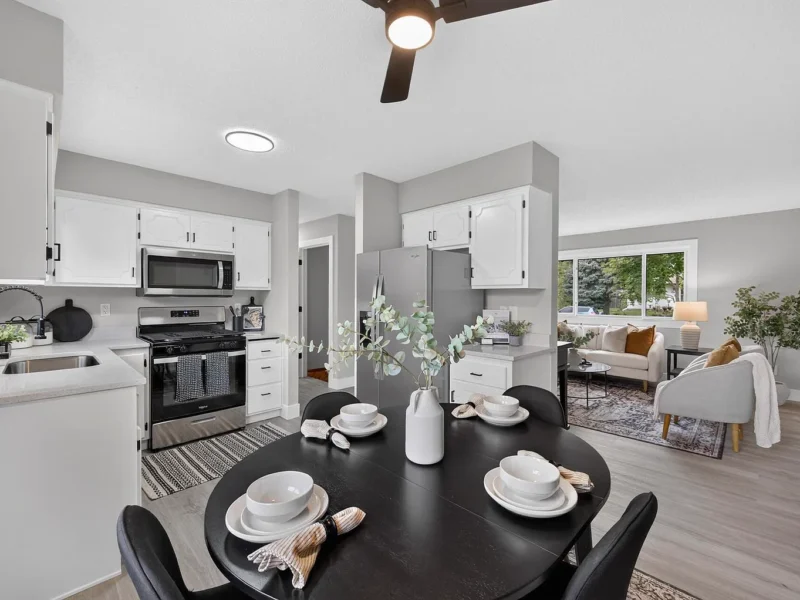 Kitchen and dining area with stainless steel appliances