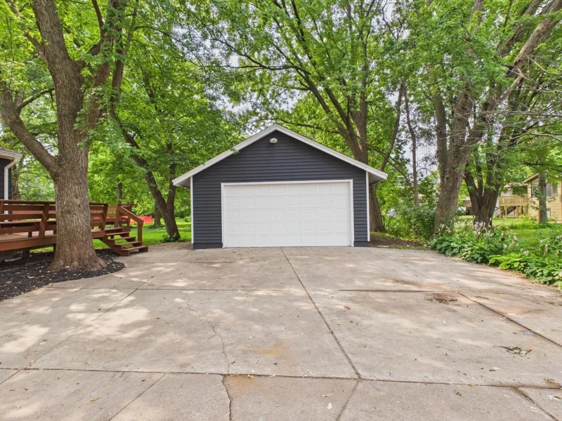 Detached two-car garage at the end of the driveway