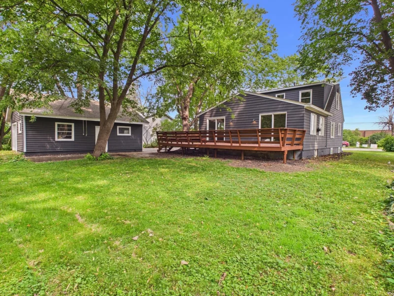 House and deck seen across the back lawn