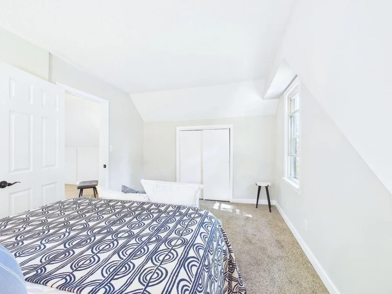 Upstairs bedroom under a sloped ceiling