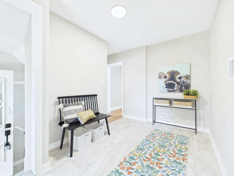 Entry area with a console table and a patterned rug