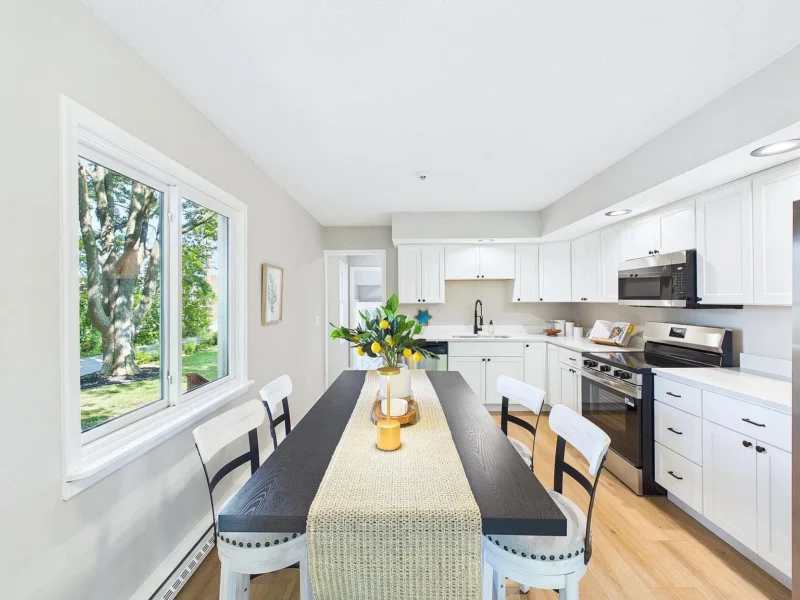 Kitchen with a bar-height counter and seating