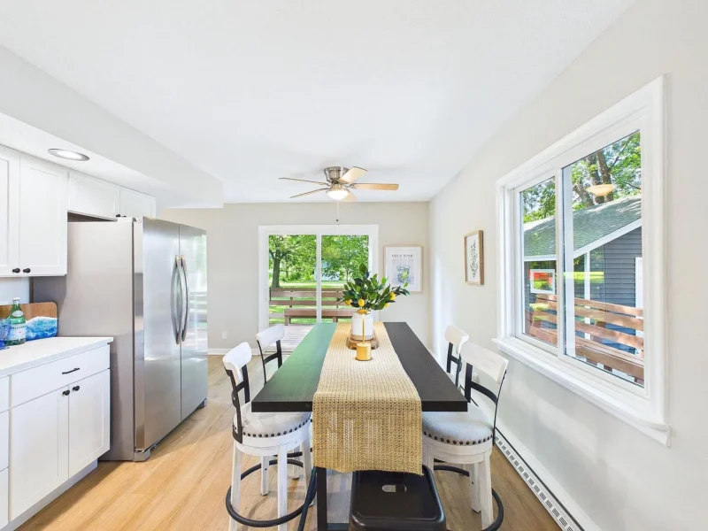 Kitchen and dining area with doors out to the deck