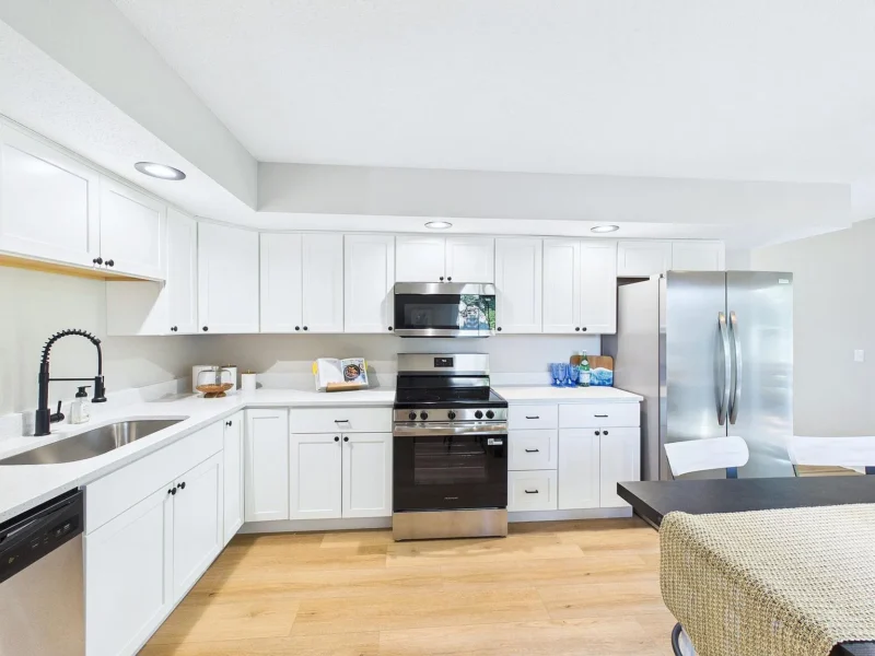 Kitchen with a stainless refrigerator and a peninsula
