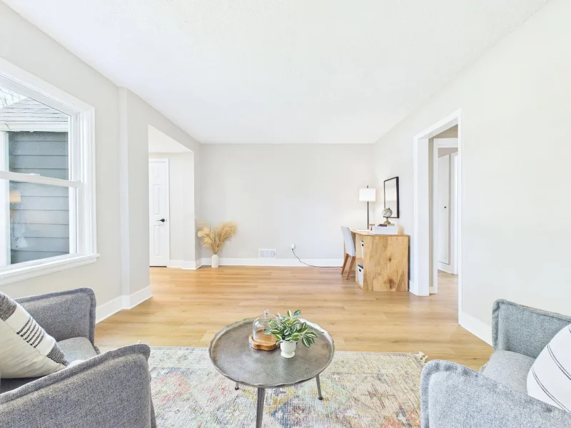 Living area with seating and a rug