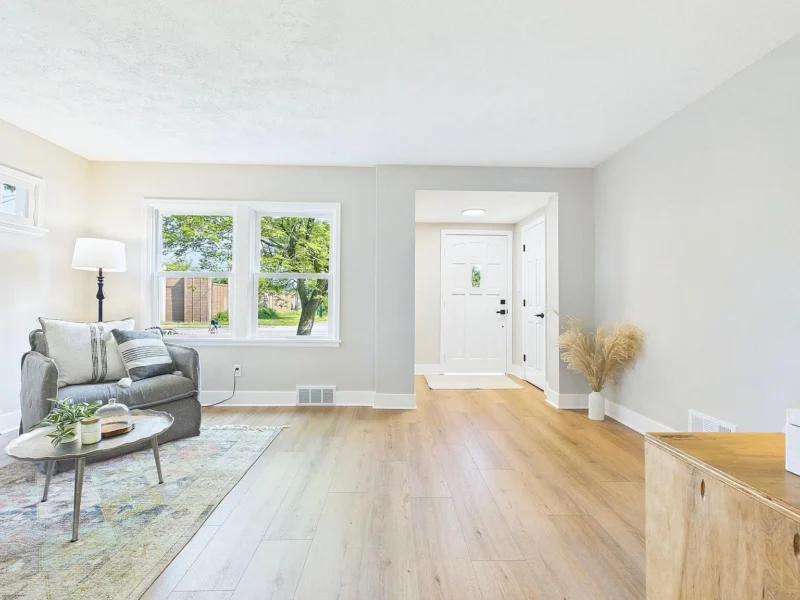 Room with a door out and a seating group